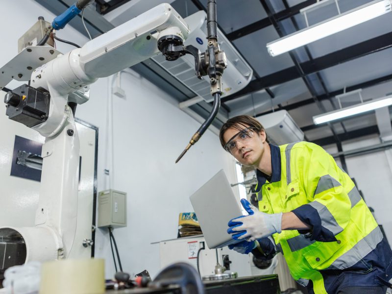 Man,Technician,Engineer,Using,Laptop,Control,Automation,Robotics,At,Industrial