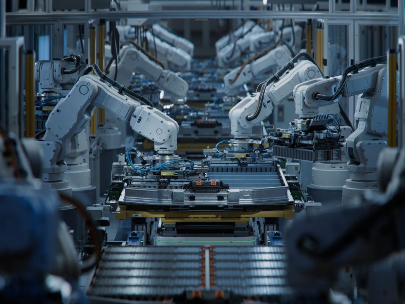 Row,Of,White,Robotic,Arms,At,Automated,Production,Line,At